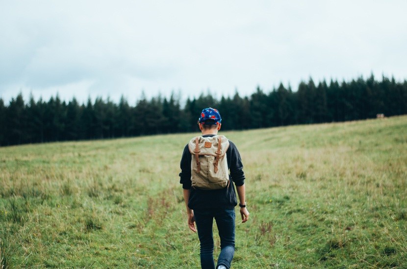 Feeling unmotivated person walking in the forest