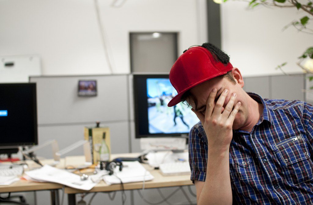 preventing you from being successful, person holding his head