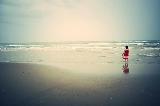 enjoy life during its downfalls, woman on the beach,