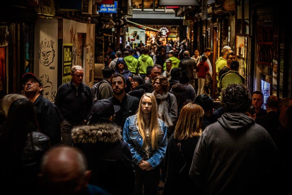 woman standing in a crowd dealing with difficult people